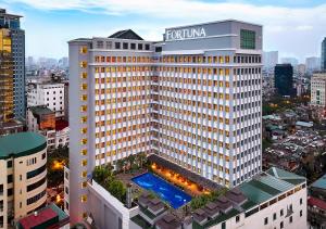 an aerial view of a hotel building with a pool at Fortuna Hotel Hanoi in Hanoi