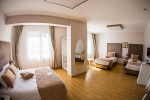 Postel nebo postele na pokoji v ubytování Bilge Suite Hotel