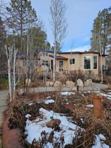 a house with snow in front of it at Gerardín in Flagstaff