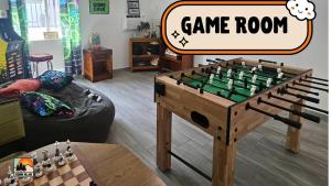 a game room with a chess board on a table at Sequoia Village in Three Rivers