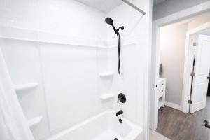 a white bathroom with a shower and a tub at Aunt Beans Guest Suite in Kanab +15 photos