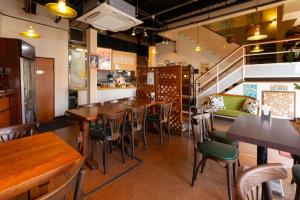 a restaurant with tables and chairs and a bar at Hotel Daiki in Osaka