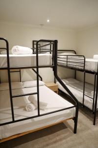 a group of bunk beds in a room at Arlberg Hotham in Mount Hotham +25 photos