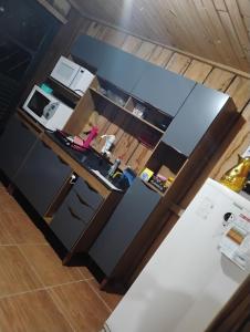 an aerial view of a kitchen with a counter top at Casa da Duda in São Gabriel