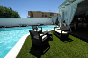 Swimmingpoolen hos eller tæt på Hotel L'Aragosta