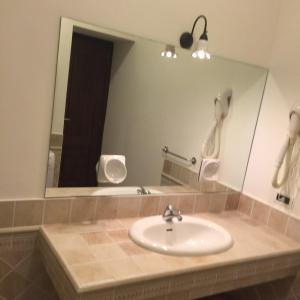a bathroom with a sink and a mirror at Milordrelais in Massa Lubrense +19 photos