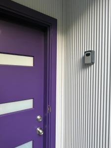 a purple door with a lock on a wall at Copacabana Fab & Funky in Copacabana