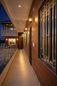 a walkway in a building at night at Ekaay The Boutique Hotel in Kumārkara