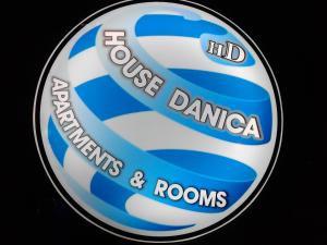 a sign for auddle danaemia androsidents and rooms at House Danica Apartments & Rooms in Sukošan