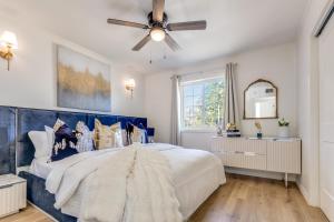 a bedroom with a large bed with a ceiling fan at The Homestead Luxury Cozy 2BR Apartment in Nacogdoches Near SFA University and Downtown Pet Friendly Business Ready Extended Stays Welcome with Self Check In High Speed WiFi Full Kitchen In Unit Laundry Private Parking and Quiet Comfort in Nacogdoches