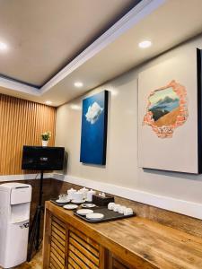 a room with a table with plates on it at Wisma Lovebird in Kalianget