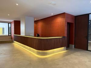 a lobby with a reception desk in a building at Kozi - Wilson Airport in Nairobi