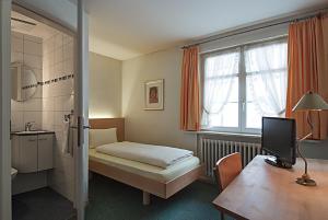 Letto o letti in una camera di Gasthof Eisenbahn