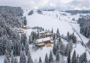 an aerial view of a resort in the snow at Hotel Orava in Dolný Kubín