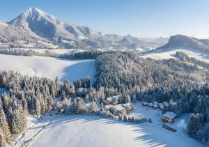 an aerial view of a resort in the snow at Hotel Orava in Dolný Kubín +80 photos