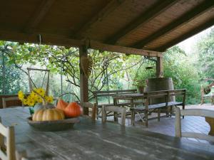 a table with a bowl of pumpkins on a patio at Pian del Pigro in Rimini