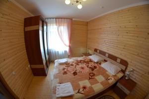 Postel nebo postele na pokoji v ubytování Sribni Rosy