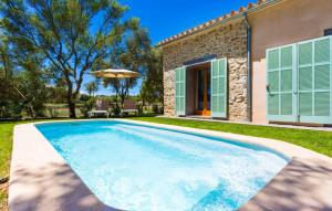 a swimming pool in the yard of a house at Na Mikeleta in Capdepera