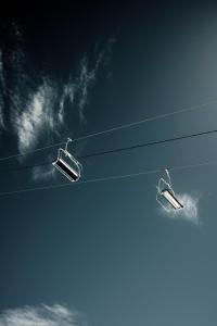 two chairs on a power line in the sky at Chalet Mestia in Mestia