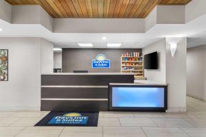 a lobby of a dental office with a large at Days Inn & Suites by Wyndham Ridgeland in Ridgeland