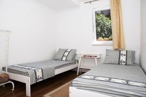 Postel nebo postele na pokoji v ubytování Apartment Roko