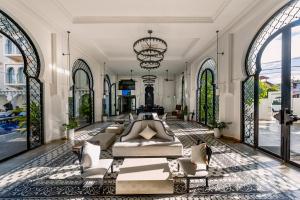 a large living room with a couch and chairs at Sarai and Wander Resort in Siem Reap +179 photos