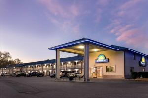 a large building with a parking lot in front of it at Days Inn by Wyndham Valdosta I-75 in Valdosta
