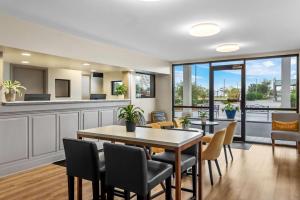 a dining room with a table and chairs at Days Inn by Wyndham Valdosta I-75 in Valdosta