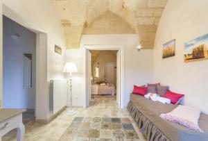 a living room with a bed in a room at La Luna In Cortile in Lecce
