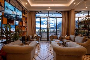 a living room with couches and a flat screen tv at Jade moon in Dali