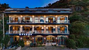 a large house with a lot of windows at Jade moon in Dali
