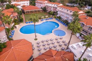 an aerial view of a resort with a swimming pool at Ölüdeniz Turquoise Hotel - All Inclusive in Oludeniz