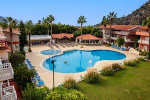 an overhead view of a swimming pool at a resort at Ölüdeniz Turquoise Hotel - All Inclusive in Oludeniz