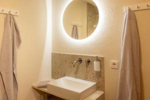 a bathroom with a sink and a mirror at Karwendelnest in Maurach
