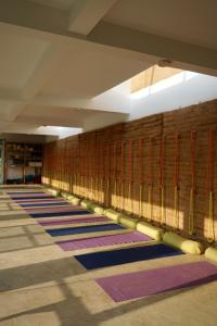 a hallway with rows of colorful rugs on the floor at Resort Vishuddhialaya Pvt Ltd in Dhulikhel