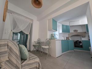a living room with a couch and a kitchen at Akti luxury aparts in Frý +16 photos