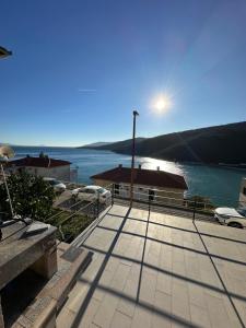 a view of a building with a view of the water at Rabac sea view in Rabac
