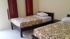 Ένα ή περισσότερα κρεβάτια σε δωμάτιο στο Belong Bunter Homestay +8 φωτογραφίες