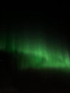 an image of the northern lights in the sky at HALLA-mökki in Tyrnävä