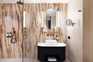 a bathroom with a sink and a mirror at Kasteel Steenenburg in Den Bosch +45 photos