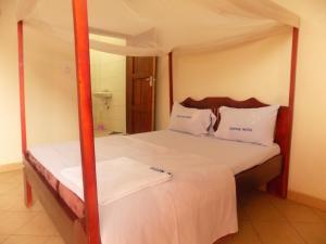 Postelja oz. postelje v sobi nastanitve Silver Motel Mbarara