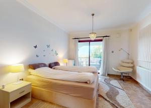 a bedroom with a large bed and a window at Villa Olive View in Kyrenia +15 photos