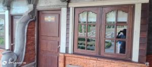 a pair of doors on the side of a building at เวียงล้านนา รีสอร์ท in Ban Muang Pha