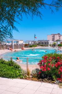 a group of people swimming in a swimming pool at Hotel Altamarea in Misano Adriatico