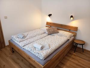a bedroom with a bed with two pillows on it at Apartmán U nás in Malá Morávka +7 photos