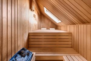 a sauna with a bench in the middle at Villa Beach & Golf in Julianadorp