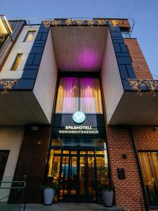 a building with a sign on the front of it at V Spa & Conference Hotel in Tartu