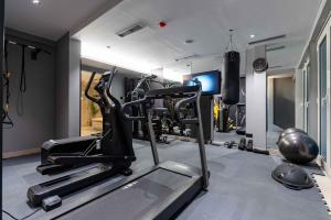 a fitness room with a gym with a treadmill at Apartment Pržno See View in Pržno