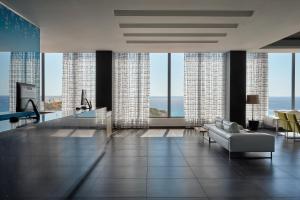 a living room with a view of the ocean at Atlantica Mikri Poli Crete in Makry Gialos