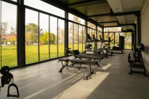 a gym with a row of chairs and windows at Wellwood Otel in Sapanca